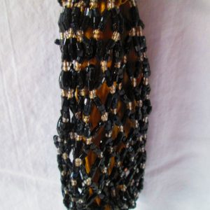 Antique Victorian Black Beaded purse Lined with Gold Fabric Ring Closure at top Glass beaded bottom and top