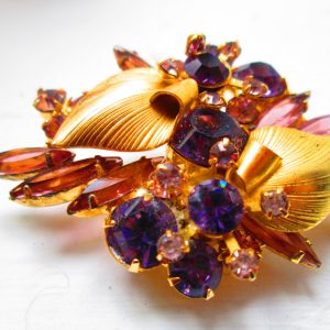 Beautiful Gold tone with amethyst color and lavender rhinestones leaves and flowers pattern
