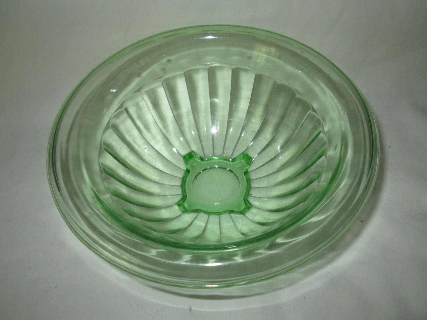 https://www.truevintageantiques.com/wp-content/uploads/2017/06/beautiful-vintage-green-depression-glass-bowl-with-wide-rim-mixing-bowl-594ad8b01.jpg