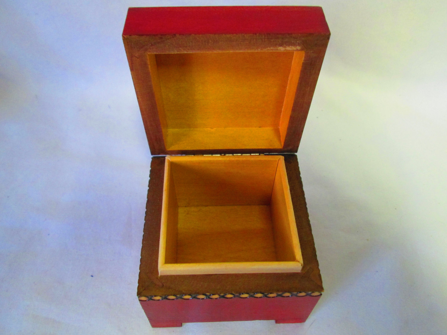 Small red jewelry box, with hinged lid