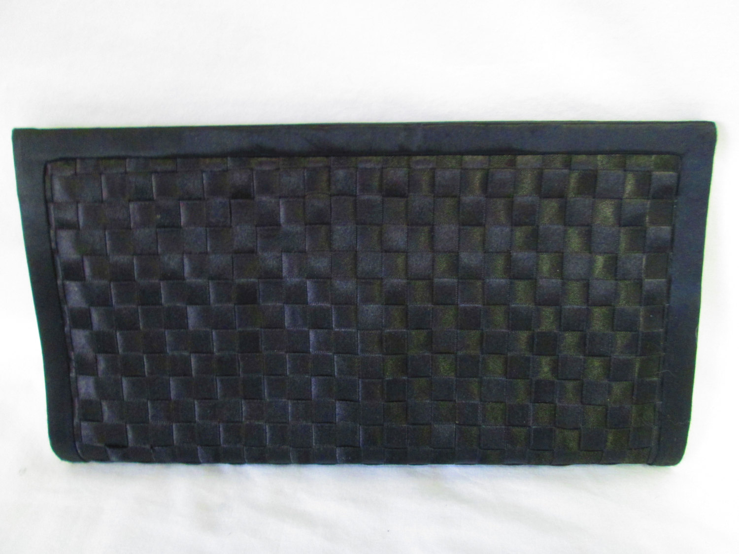 black woven clutch bag