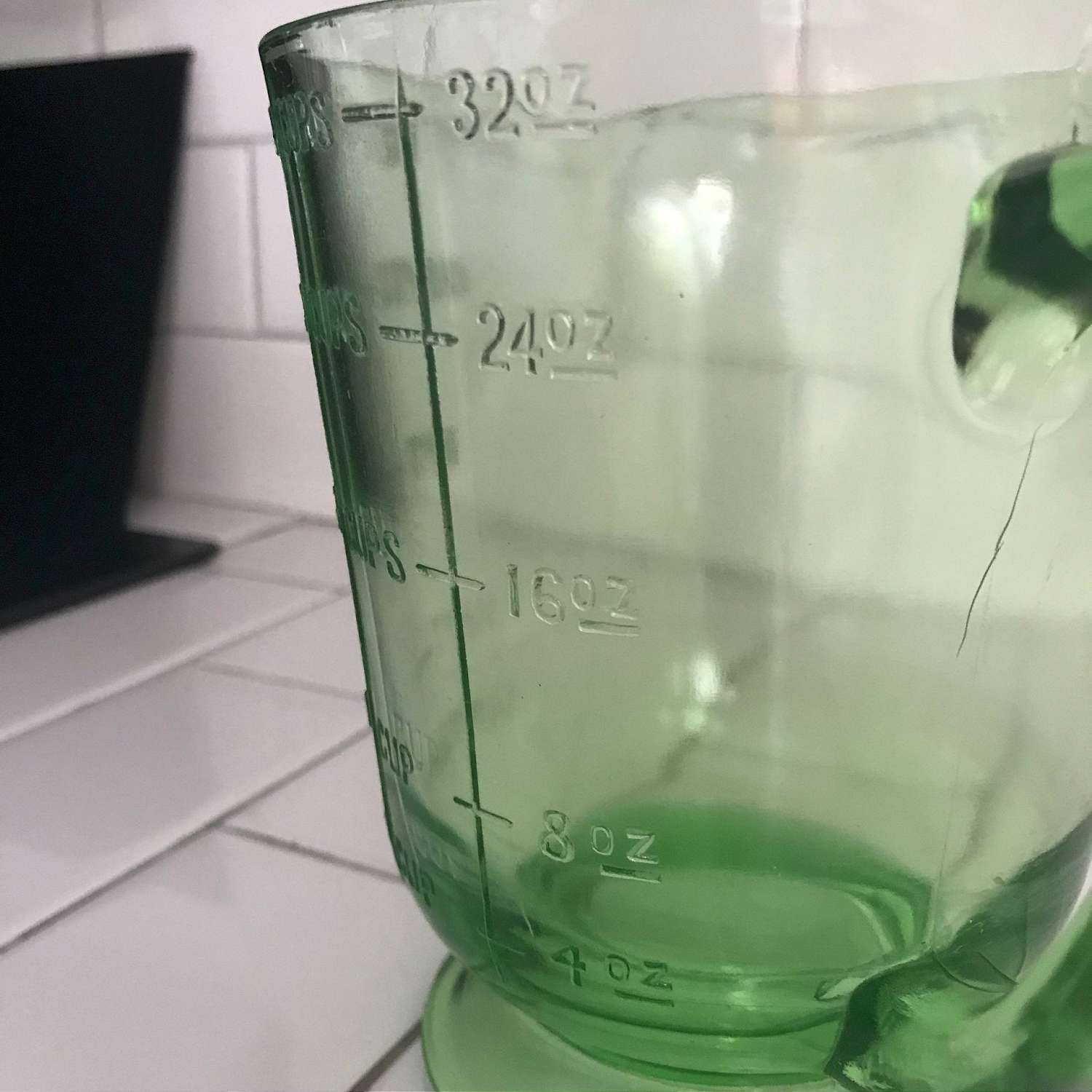 https://www.truevintageantiques.com/wp-content/uploads/2019/12/antique-uranium-glass-measuring-cup-4-cups-green-kitchen-collectible-display-farmhouse-glows-green-5df1795d9-scaled.jpg