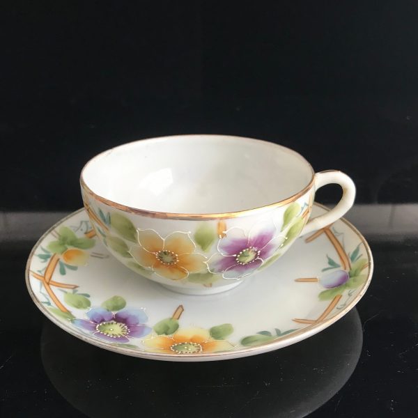 Beautiful hand painted Floral Yellow and Purple with enameled white trim around flowers fencing background unique and rare collectible