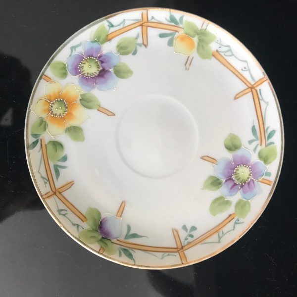Beautiful hand painted Floral Yellow and Purple with enameled white trim around flowers fencing background unique and rare collectible