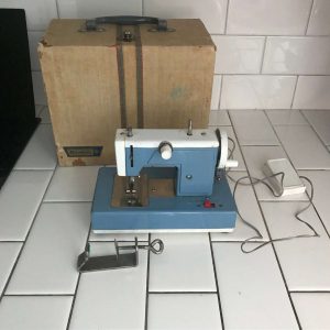 Child size BROTHER sewing machine Blue & white metal original 1930's hand crank or battery operated In Original Case collectible display