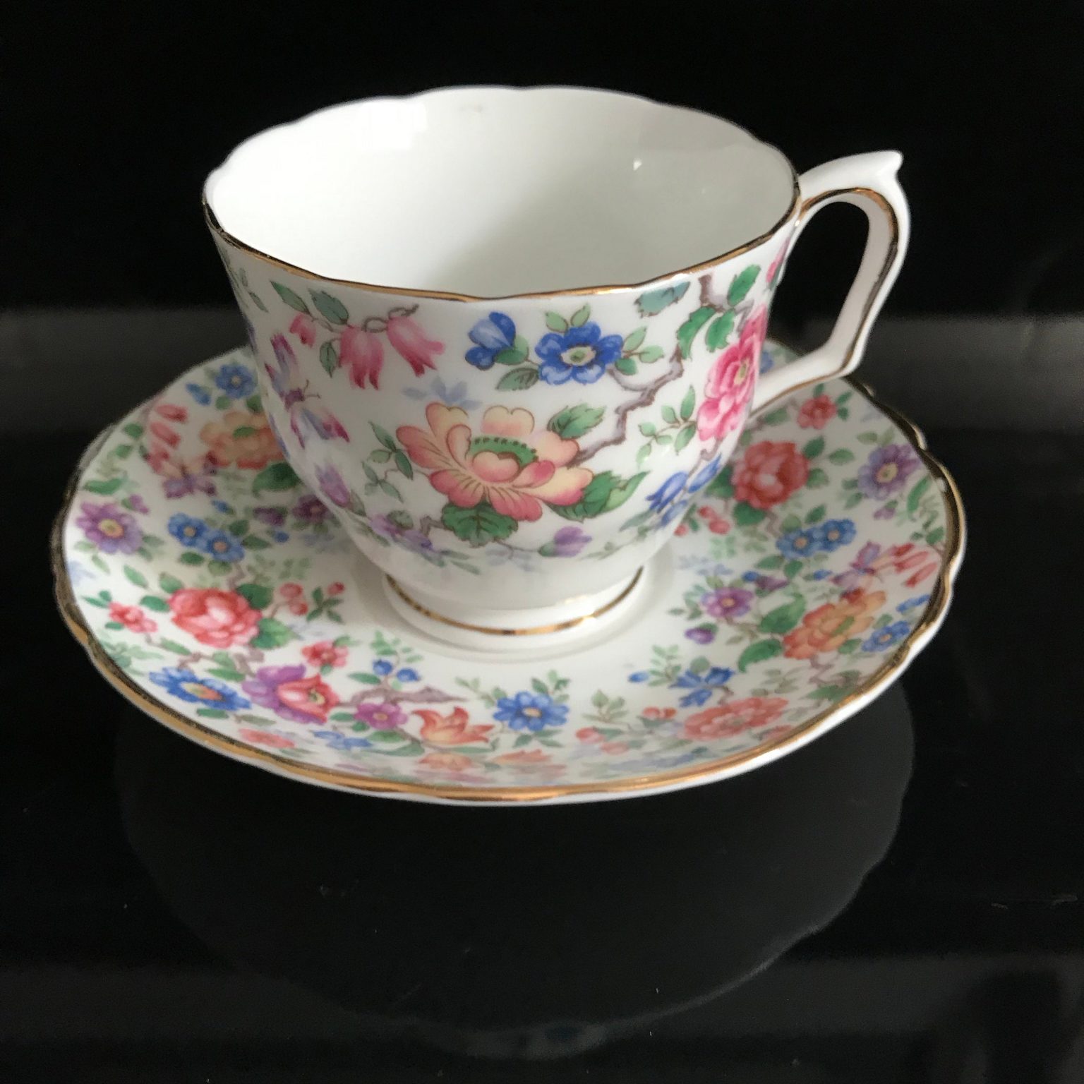 Crown Staffordshire Tea Cup And Saucer England Fine Bone China Pink Purple Blue Flowers Chintz