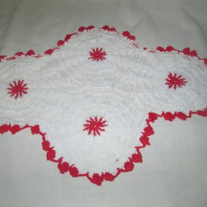 Pretty white hand made doily red trim and centers