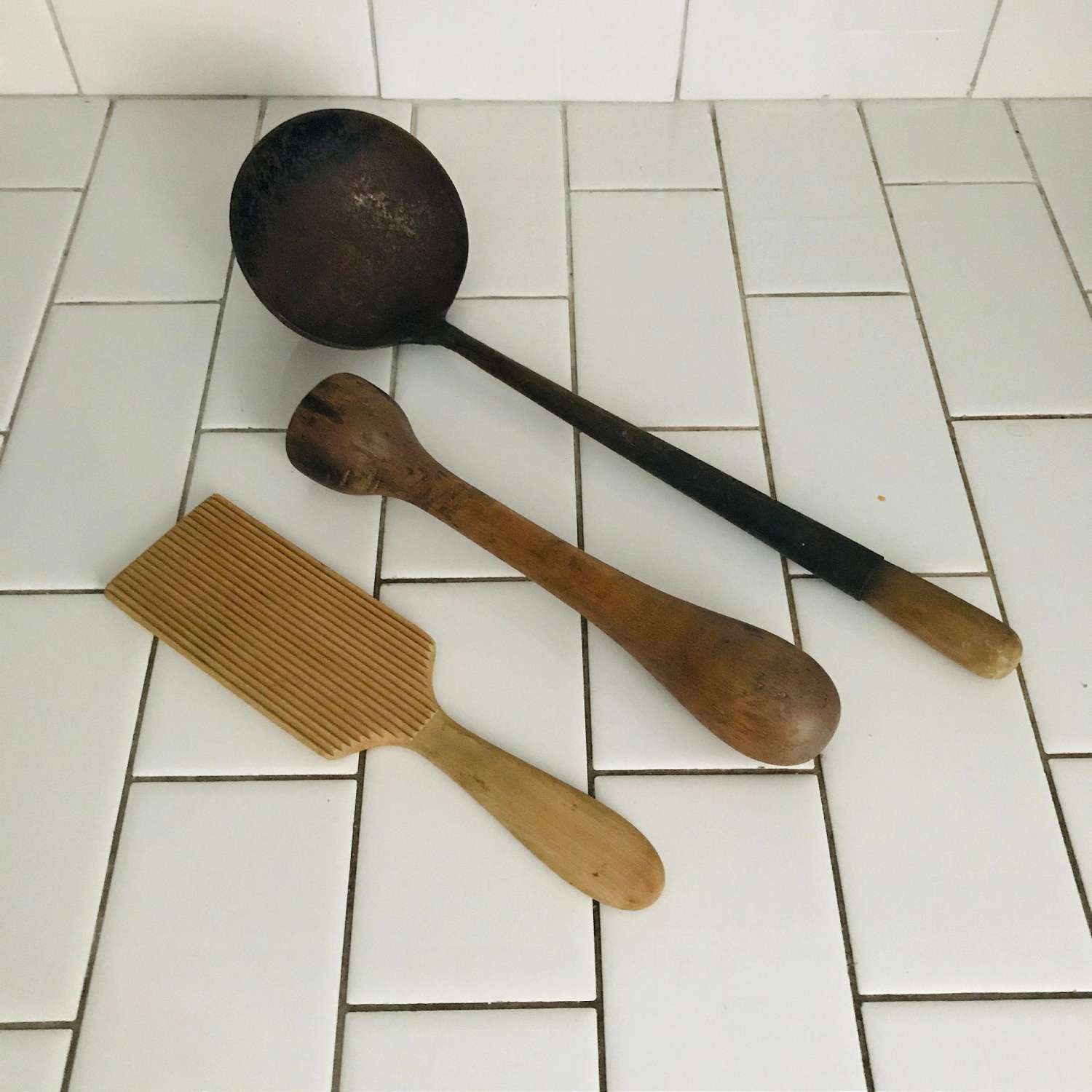 https://www.truevintageantiques.com/wp-content/uploads/2019/12/primitive-kitchen-tools-iron-ladle-wooden-zester-and-masher-collectible-farmhouse-cabin-lodge-wall-decor-antique-kitchen-display-gadgets-5df2517a1-scaled.jpg