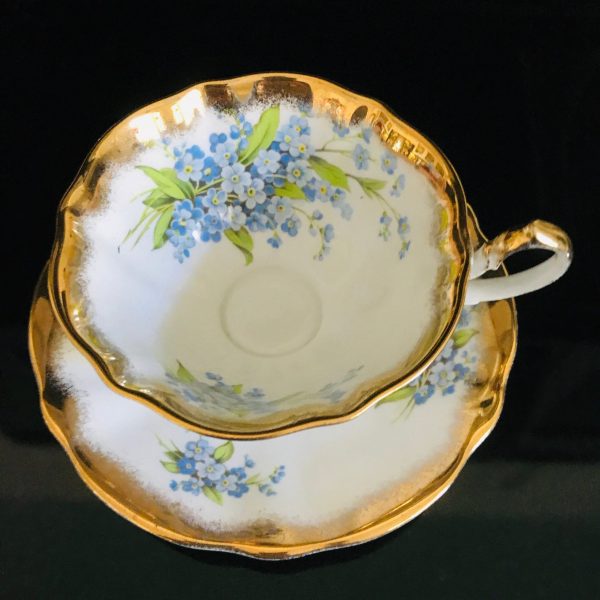 Queen Anne tea cup and saucer England Fine bone china Light Blue Flowers yellow centers heavy gold trim farmhouse collectible display coffee