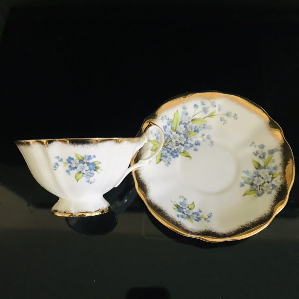 Queen Anne tea cup and saucer England Fine bone china Light Blue Flowers yellow centers heavy gold trim farmhouse collectible display coffee
