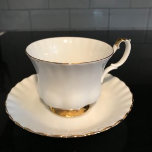 Royal Albert tea cup and saucer England Fine bone china White with gold trim farmhouse collectible display coffee serving sleek