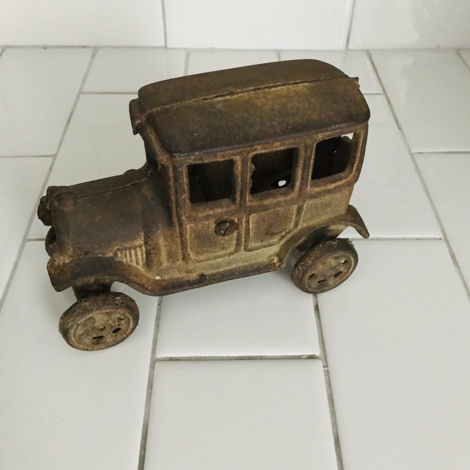 Vintage Cast Iron Car Toy Collectible metal with rotating cast iron