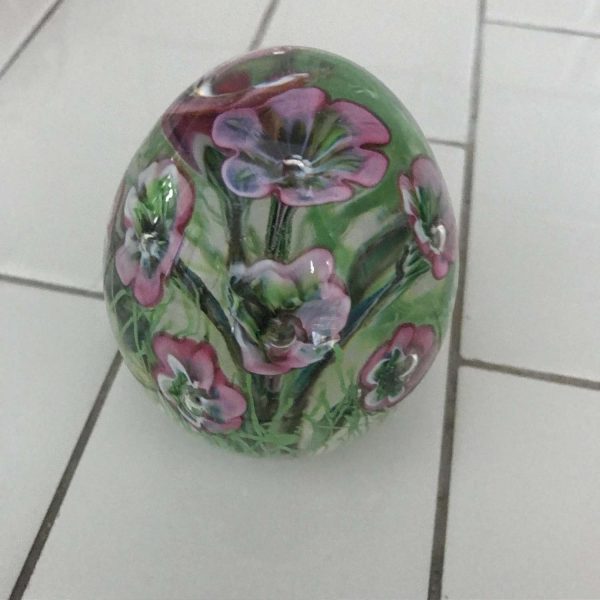 Vintage glass paperweight with pink and purple flowers inside hand blown glass office collectible display