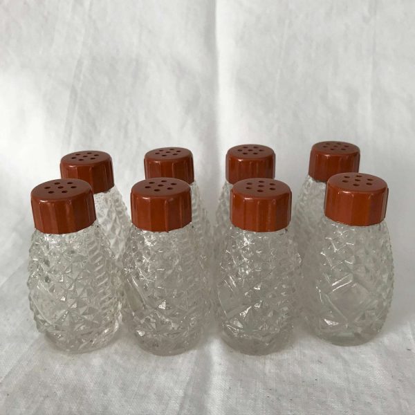 Vintage individual 8 Salt Shakers Glass with bakelite mustard colored lids Retro Kitchen collectible display farmhouse fine dining