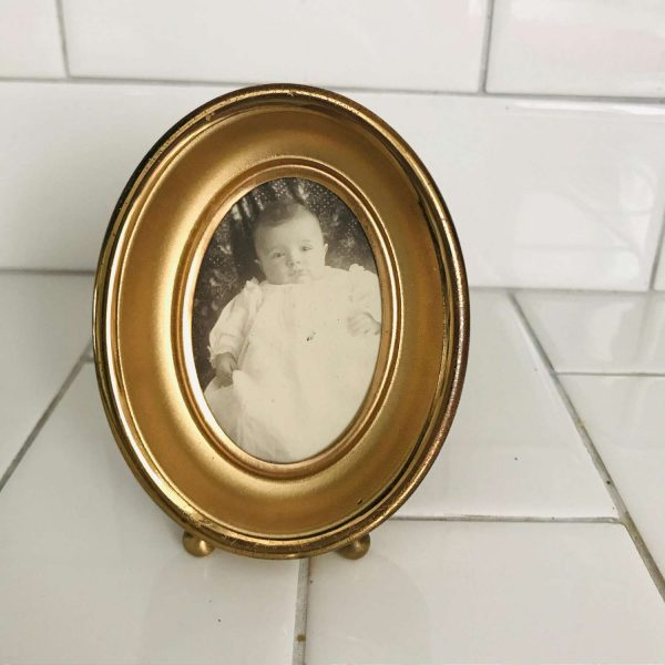 Vintage oval picture frame gold tone with baby photo from the 1940's collectible display farmhouse