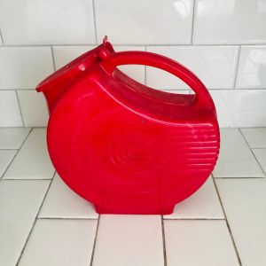 Vintage red plastic disc pitcher lidded with ribbed pattern swirl white in plastic farmhouse retro kitchen collectible display 1950's