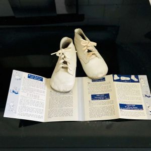 Vintage White leather baby shoes with care instructions Mrs. Day's Ideal abby Shoe Guide Display collectible dolls nursery