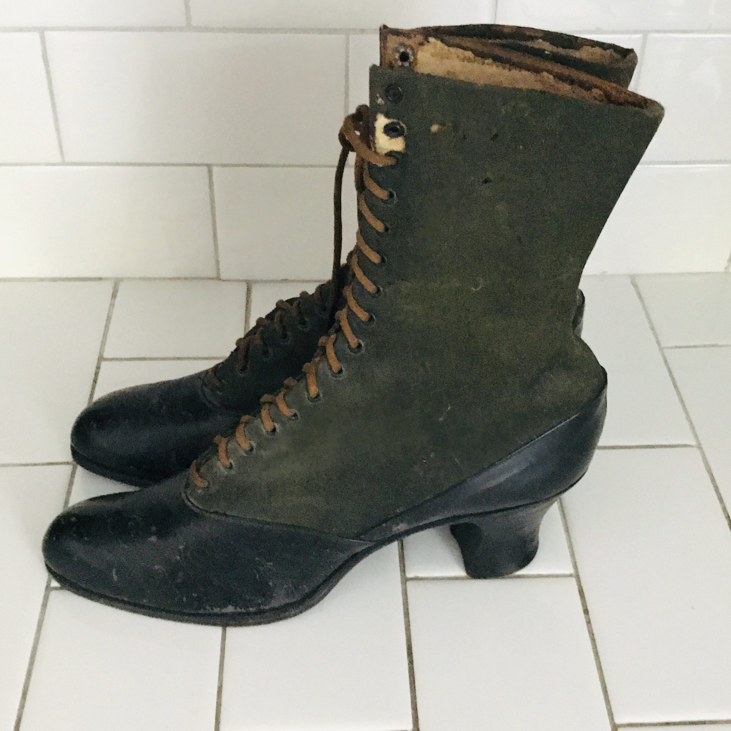 Antique women's boots shoes leather with fabric lace up Museum