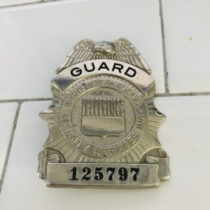 Obsolete Guard Badge Burns International Security Services #125797 collectible memorabilia display silver tone with blue