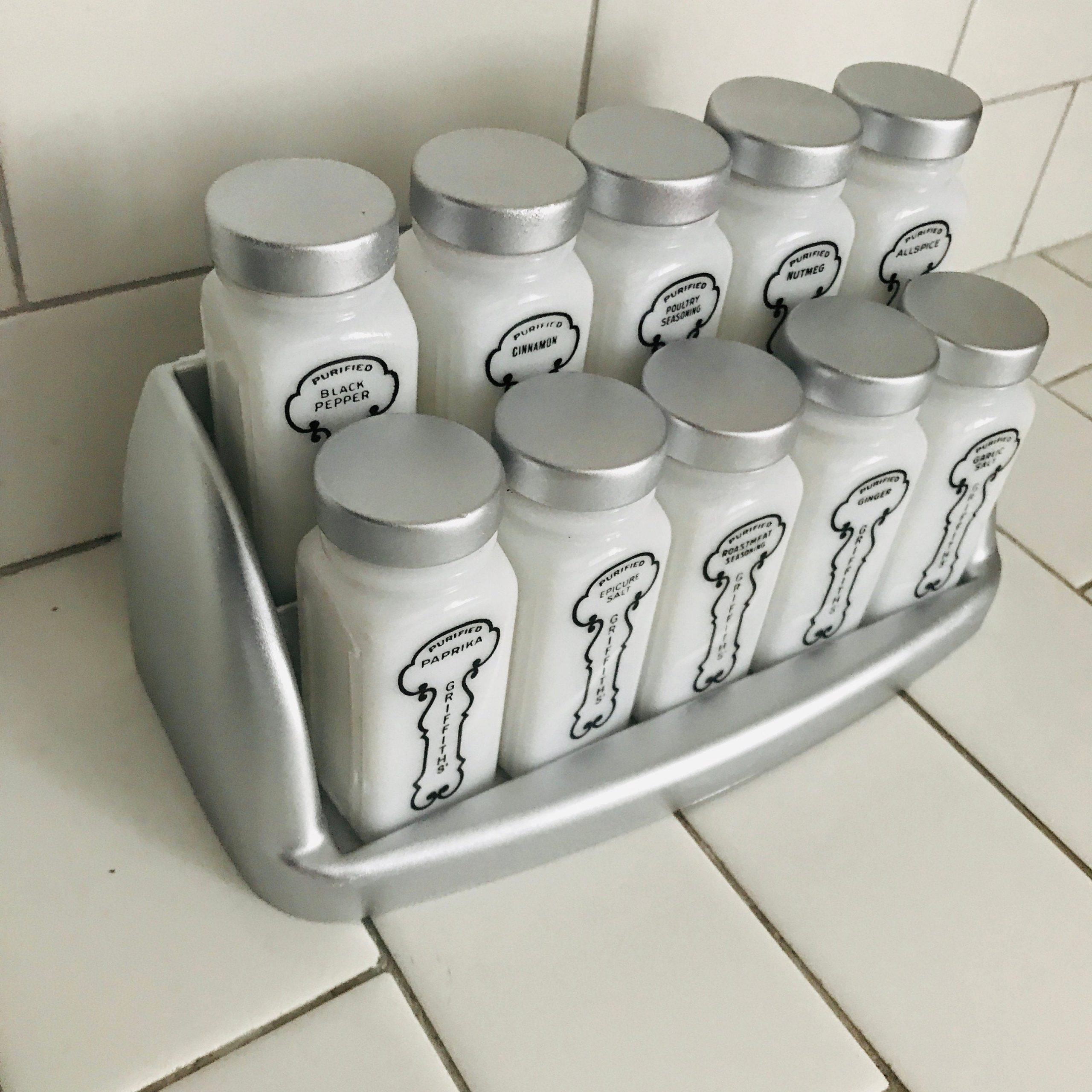 https://www.truevintageantiques.com/wp-content/uploads/2020/06/vintage-1950s-milk-glass-spice-jars-spices-rack-with-10-griffiiths-chrome-color-lids-rack-farmhouse-collectible-display-retro-kitchen-5ee000845-scaled.jpg