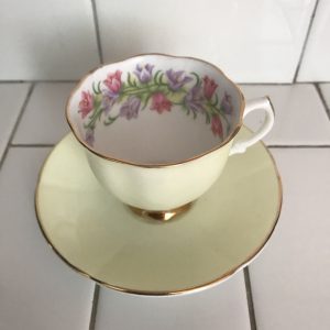 Vintage Consort Tea cup and saucer England fine bone china collectible display wedding bridal shower dainty flowers inside light yellow