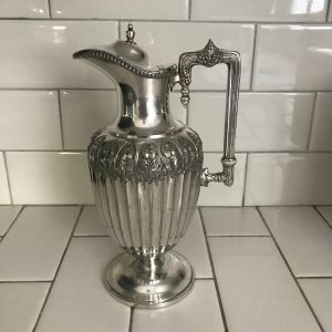 Stunning Wine Pitcher Victorian ornately detailed ribbed body with extremely ornate hand chased pattern around the top square handle display