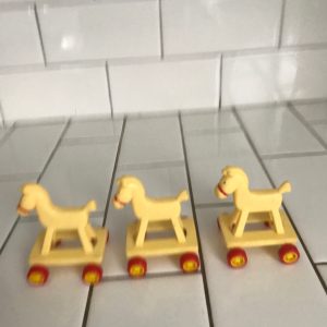 Darling 1986 McDonalds rolling horses set of 3 great birthday cake toppers plastic yellow and orange rolling hard plastic collectible